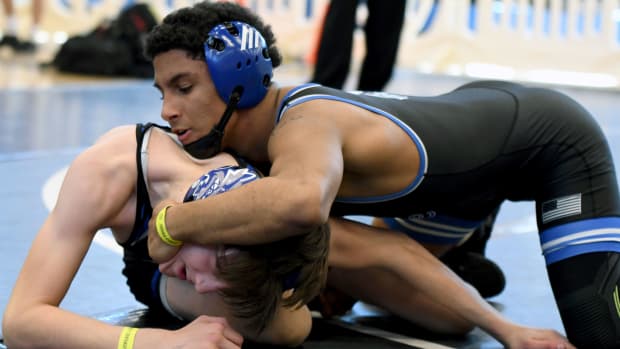 South Dade’s Luis Acevedo works his way to a tech fall win in a 120-pound match against Mark Bofantae of Wellington Community on Saturday at the FHSAA Duals wrestling state championships at Osceola High School.